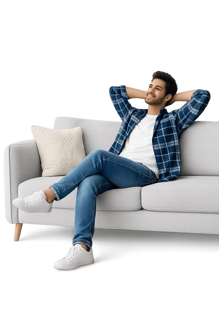 Resident relaxing comfortably on a furnished sofa